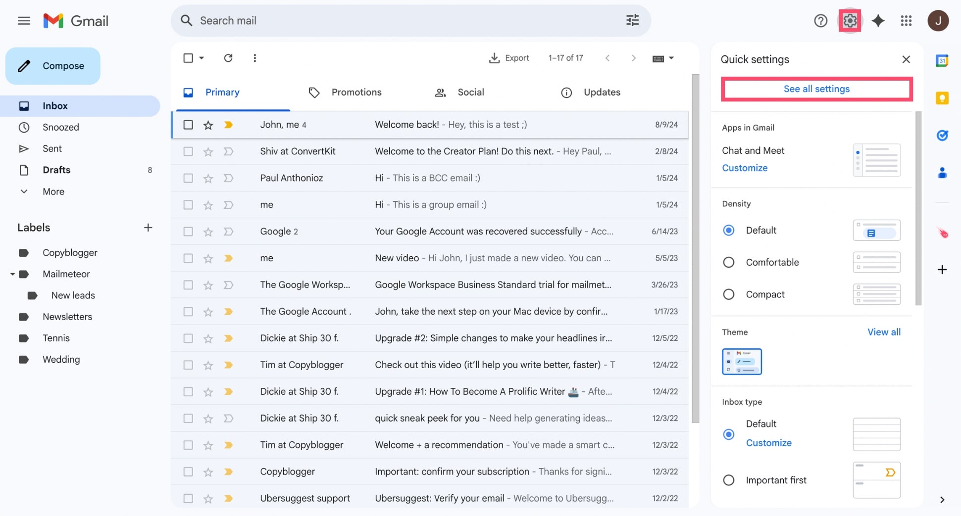 Gmail inbox with the settings gear icon highlighted